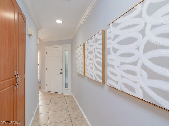 corridor with crown molding and light tile patterned flooring