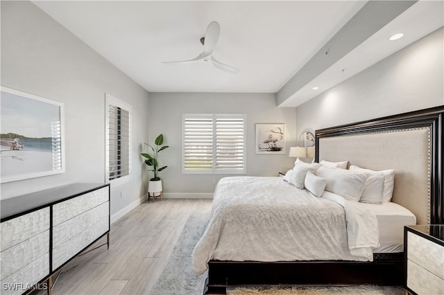 bedroom with ceiling fan and light hardwood / wood-style flooring