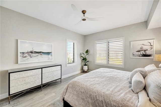 bedroom featuring ceiling fan and light hardwood / wood-style flooring