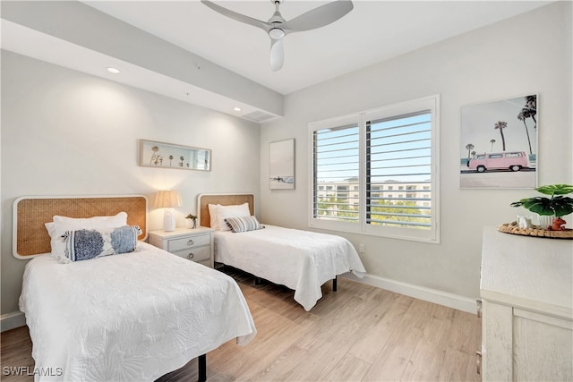 bedroom featuring light hardwood / wood-style floors and ceiling fan