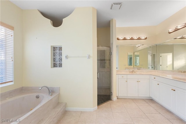 bathroom with vanity, tile patterned floors, and separate shower and tub