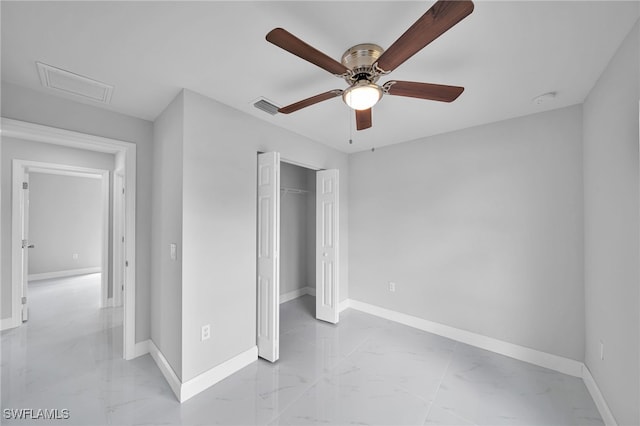 unfurnished bedroom with ceiling fan and a closet