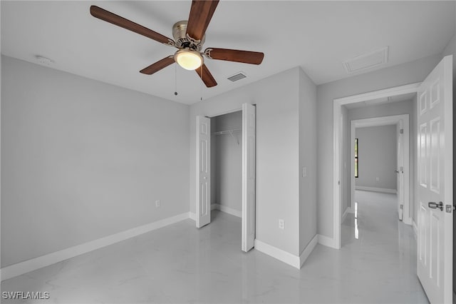 unfurnished bedroom with ceiling fan and a closet