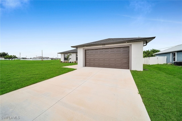 view of front of home with a garage and a front yard