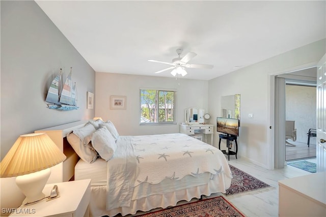 3032 Sandpiper Bay Cir Unit G305, Naples, FL 34112 - bedroom with light marble finish floors and a ceiling fan