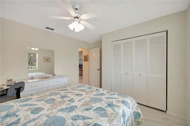 3032 Sandpiper Bay Cir Unit G305, Naples, FL 34112 - bedroom with a closet, light marble finish floors, and ceiling fan