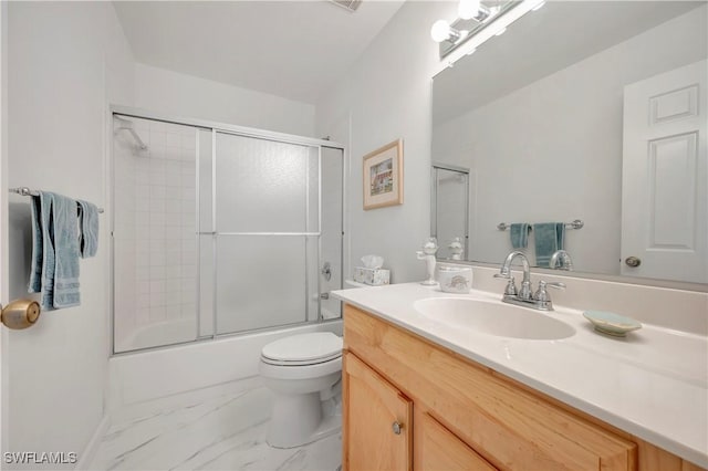 3032 Sandpiper Bay Cir Unit G305, Naples, FL 34112 - bathroom with marble finish flooring, toilet, vanity, and shower / bath combination with glass door