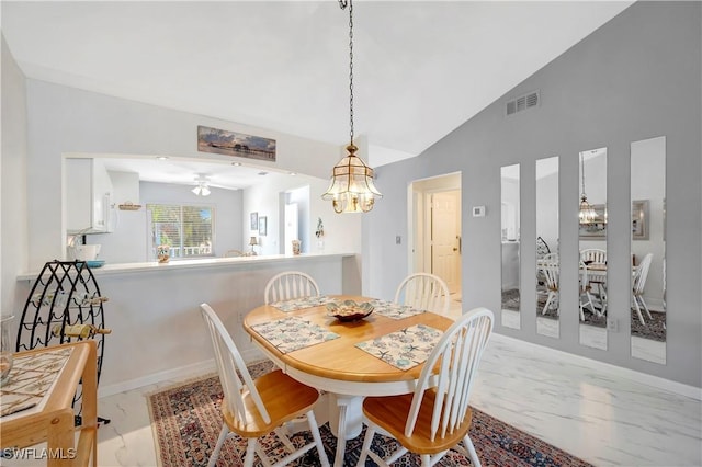 3032 Sandpiper Bay Cir Unit G305, Naples, FL 34112 - dining room with light marble finish flooring, a chandelier, and high vaulted ceiling