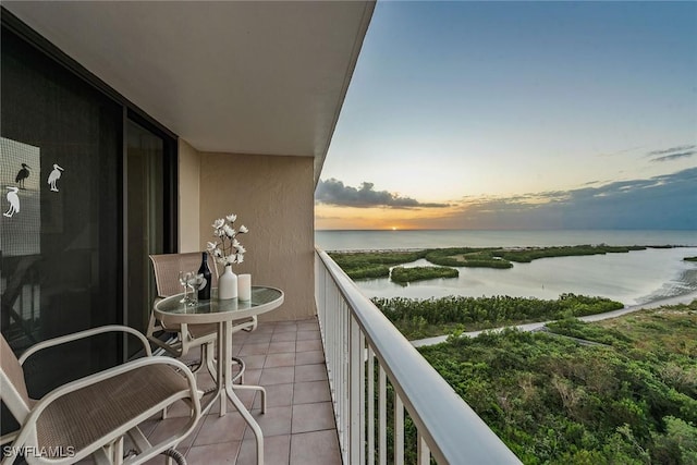 balcony at dusk with a water view