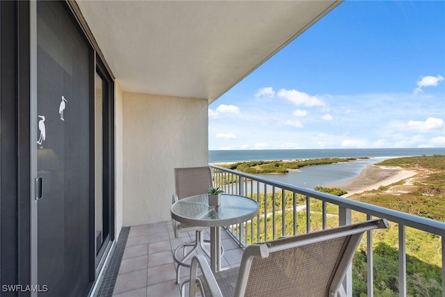 balcony featuring a water view