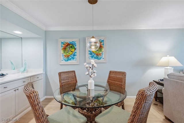 dining room featuring crown molding