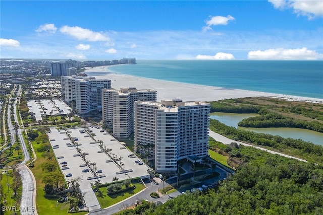 aerial view featuring a view of the beach and a water view