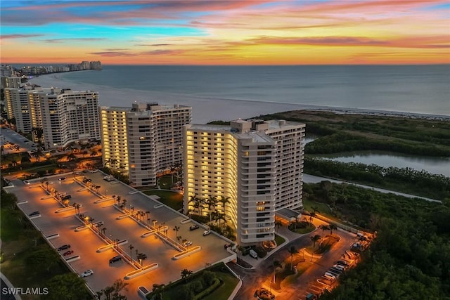 aerial view at dusk with a water view