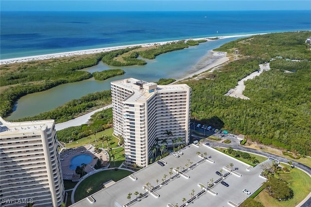 birds eye view of property featuring a water view and a view of the beach