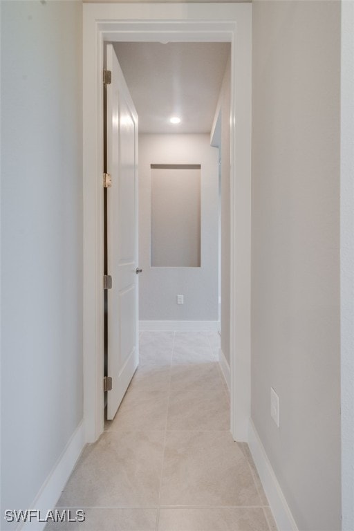 corridor with light tile patterned floors