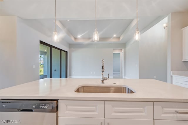 kitchen featuring sink, hanging light fixtures, stainless steel dishwasher, a center island with sink, and white cabinets