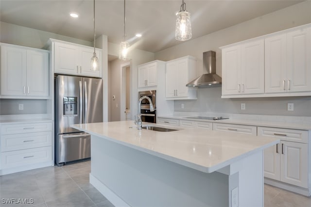 kitchen with pendant lighting, white cabinets, a center island with sink, wall chimney exhaust hood, and stainless steel fridge with ice dispenser