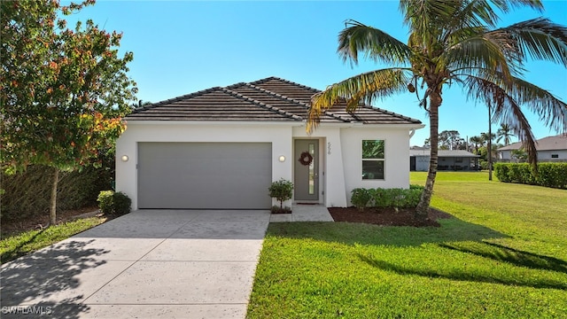 view of front facade with a front yard and a garage