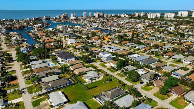 birds eye view of property featuring a water view