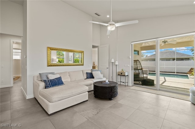 living room with high vaulted ceiling