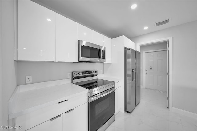 kitchen with white cabinets and stainless steel appliances