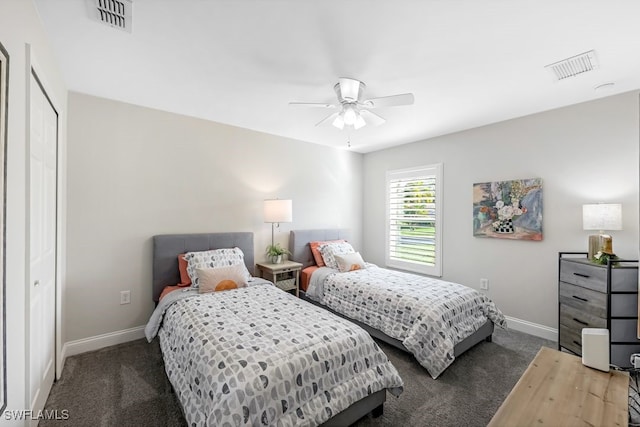 carpeted bedroom with ceiling fan and a closet