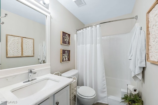 bathroom featuring toilet, vanity, and a shower with shower curtain