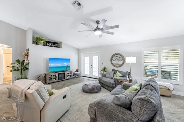 living room with vaulted ceiling, ceiling fan, plenty of natural light, and french doors