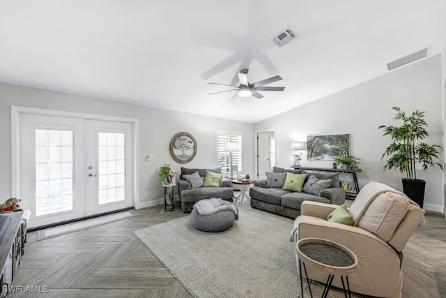 living room featuring ceiling fan, lofted ceiling, parquet floors, and french doors