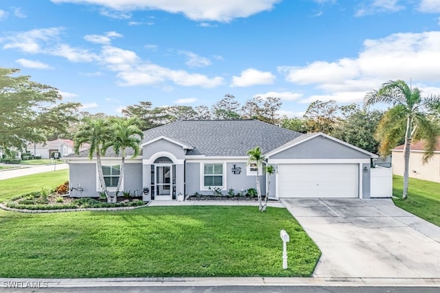 single story home featuring a front yard and a garage