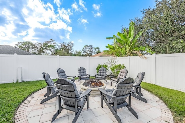 view of patio / terrace with a fire pit