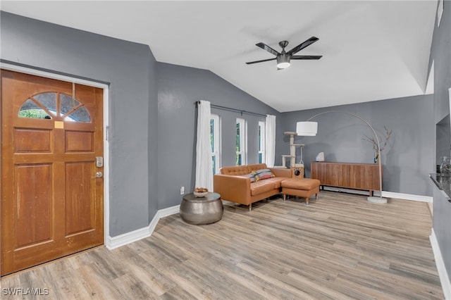 entrance foyer featuring ceiling fan, light hardwood / wood-style floors, and lofted ceiling