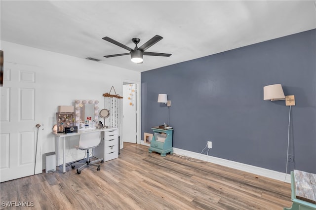 unfurnished office featuring ceiling fan and light hardwood / wood-style floors