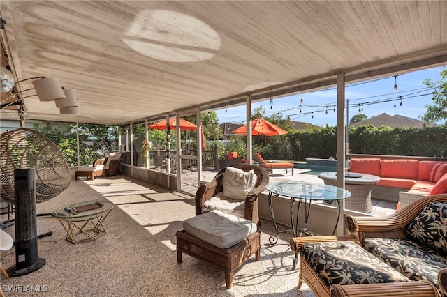 sunroom featuring wood ceiling