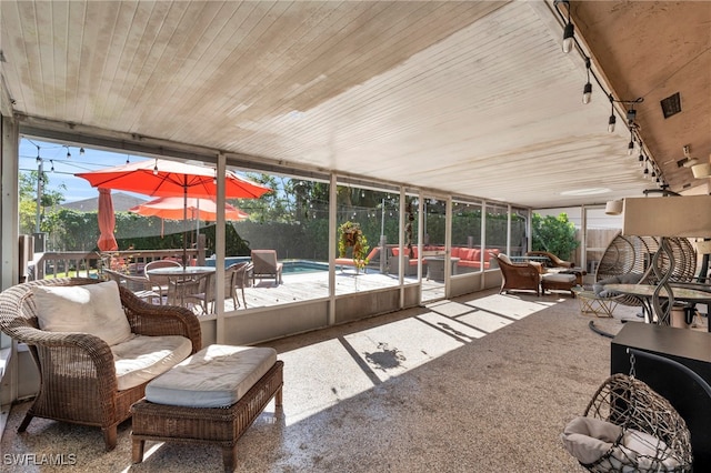 sunroom / solarium with track lighting