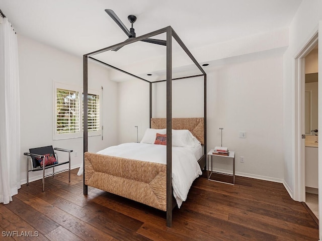 bedroom featuring dark hardwood / wood-style floors, ensuite bath, and ceiling fan