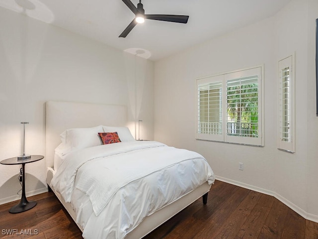 bedroom with ceiling fan and dark hardwood / wood-style flooring