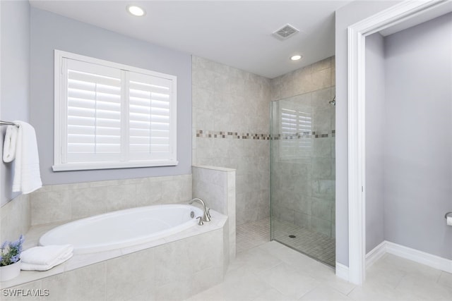 bathroom featuring a garden tub, recessed lighting, tile patterned flooring, baseboards, and walk in shower