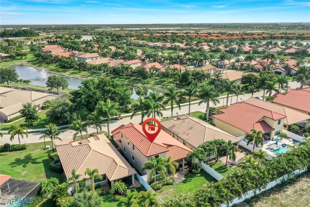 bird's eye view featuring a water view and a residential view