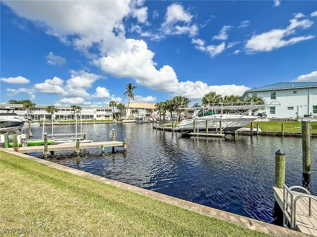 dock area featuring a yard and a water view