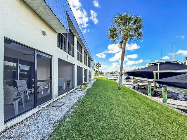 view of yard with a boat dock