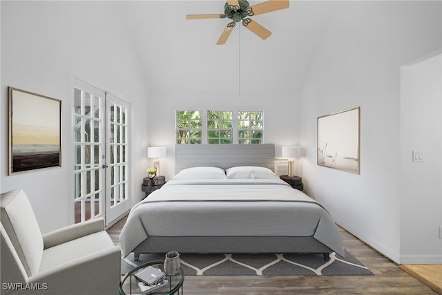 bedroom with high vaulted ceiling, hardwood / wood-style floors, and ceiling fan