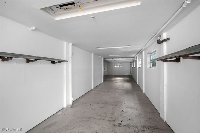 hallway with concrete flooring