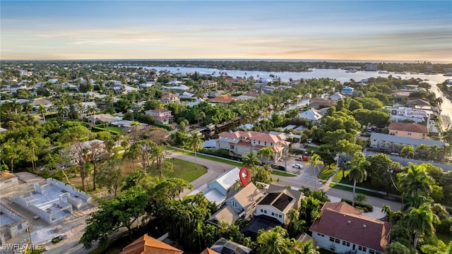 aerial view at dusk with a water view