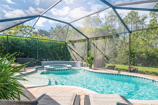 view of pool featuring an in ground hot tub and a lanai