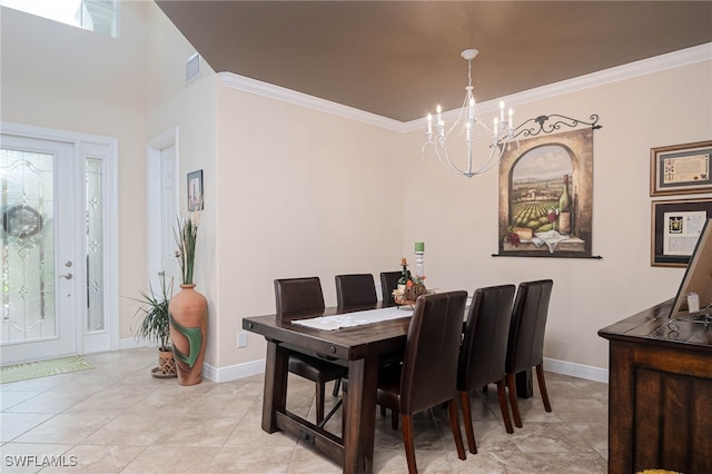 tiled dining area featuring crown molding and a chandelier