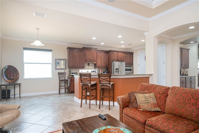 tiled living room featuring crown molding