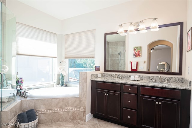 bathroom with tile patterned flooring, ceiling fan, separate shower and tub, and vanity