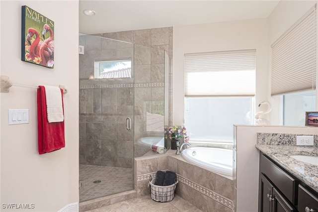 bathroom featuring vanity and plus walk in shower