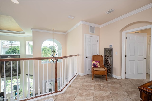 hallway featuring ornamental molding and a chandelier